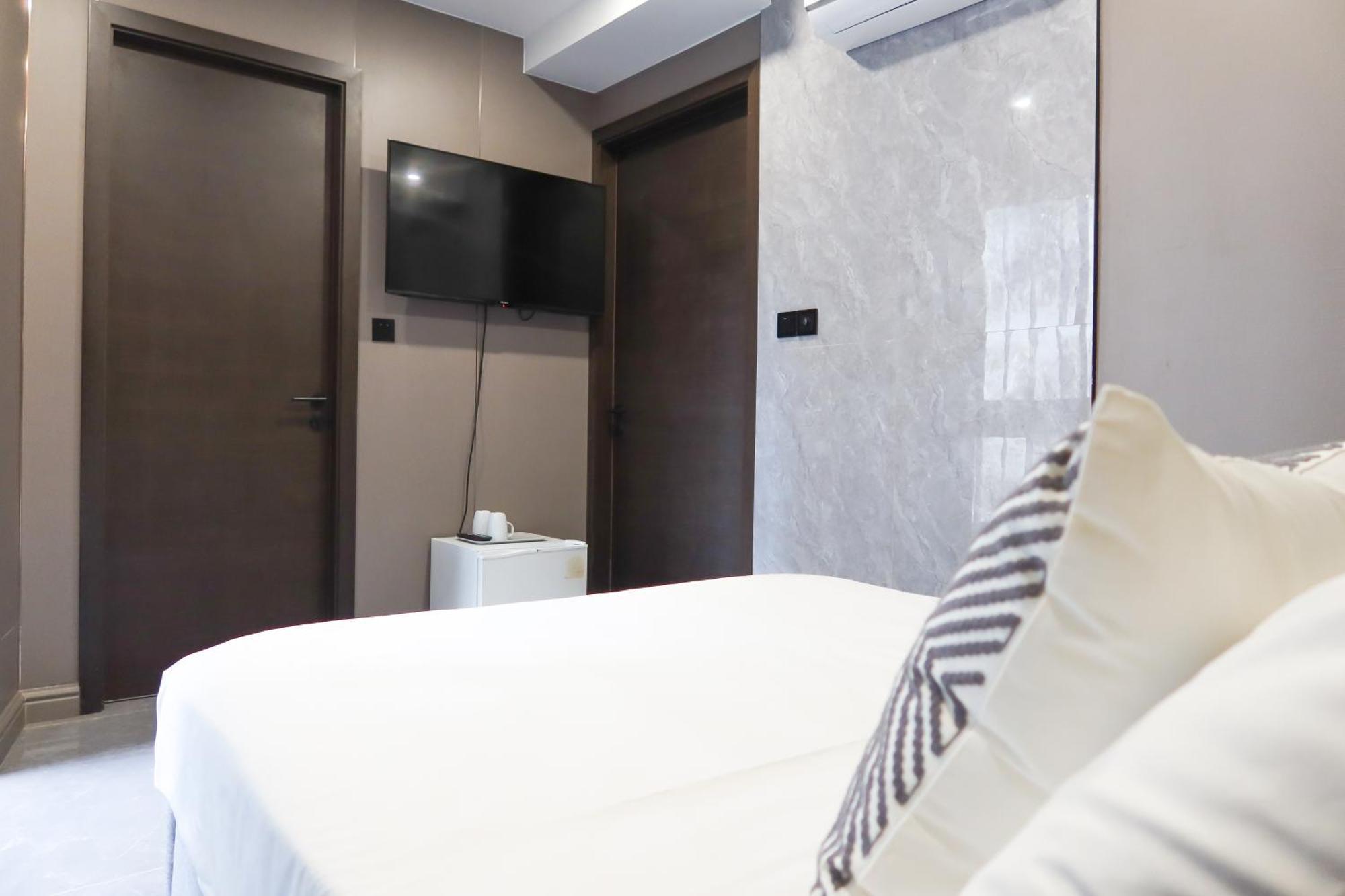 Recharge Studio Apartment & Suites Szingapúr Szoba fotó
