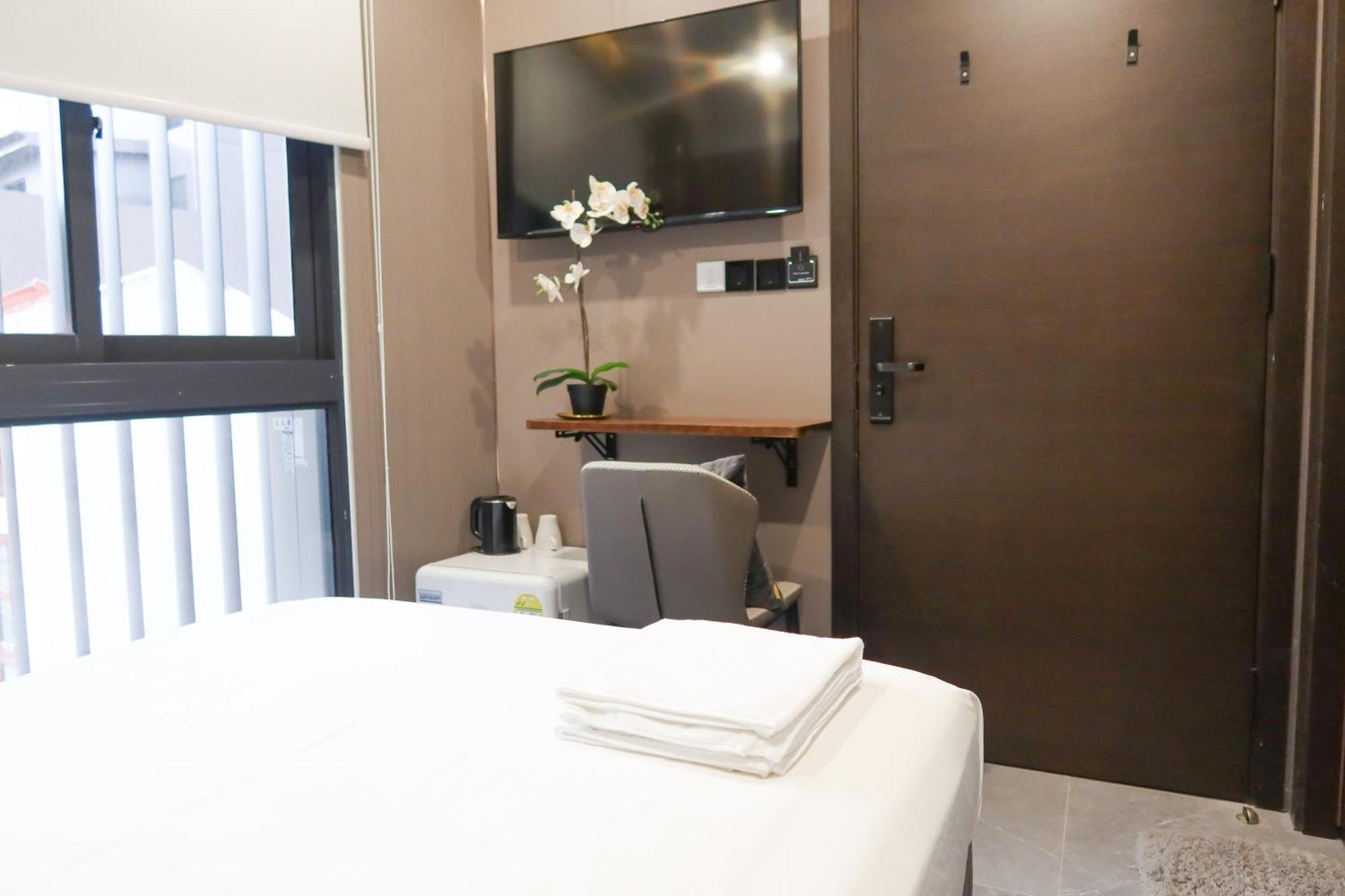 Recharge Studio Apartment & Suites Szingapúr Szoba fotó
